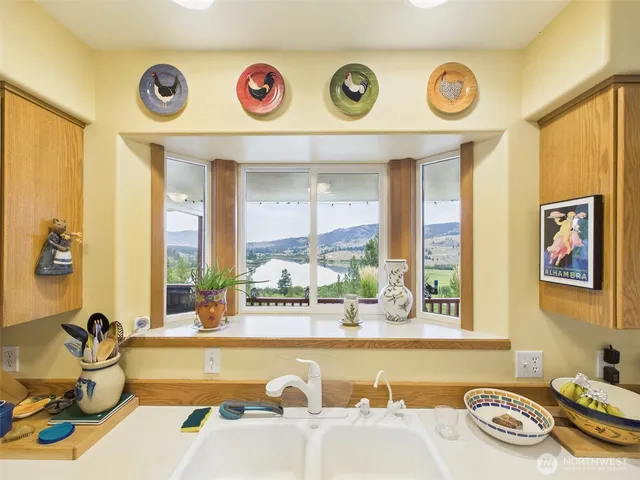 a bathroom with a tub and a view of living room