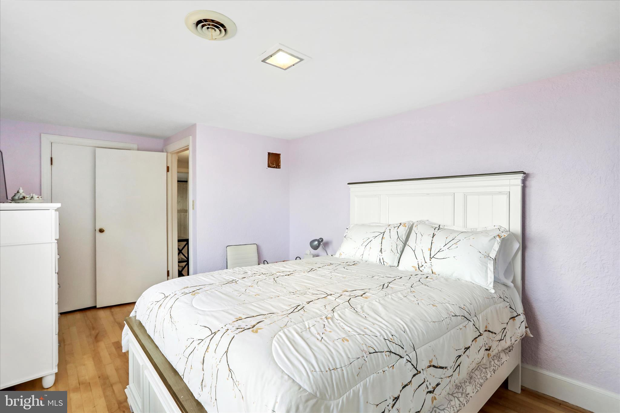 425 West 15th Street Front Royal, VA 22630 - Photo 27 of 47 a bedroom with a bed and a night stand