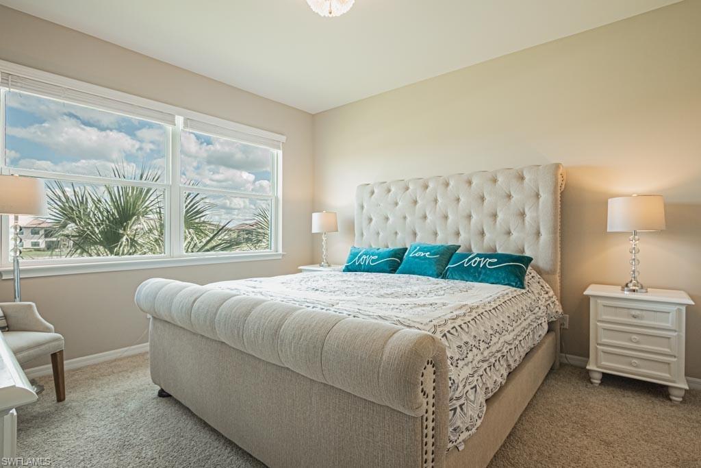 9378 Pocida Court, Unit 202 Naples, FL 34119 - Photo 6 of 41 pocket doors to two walk-in closets & bath