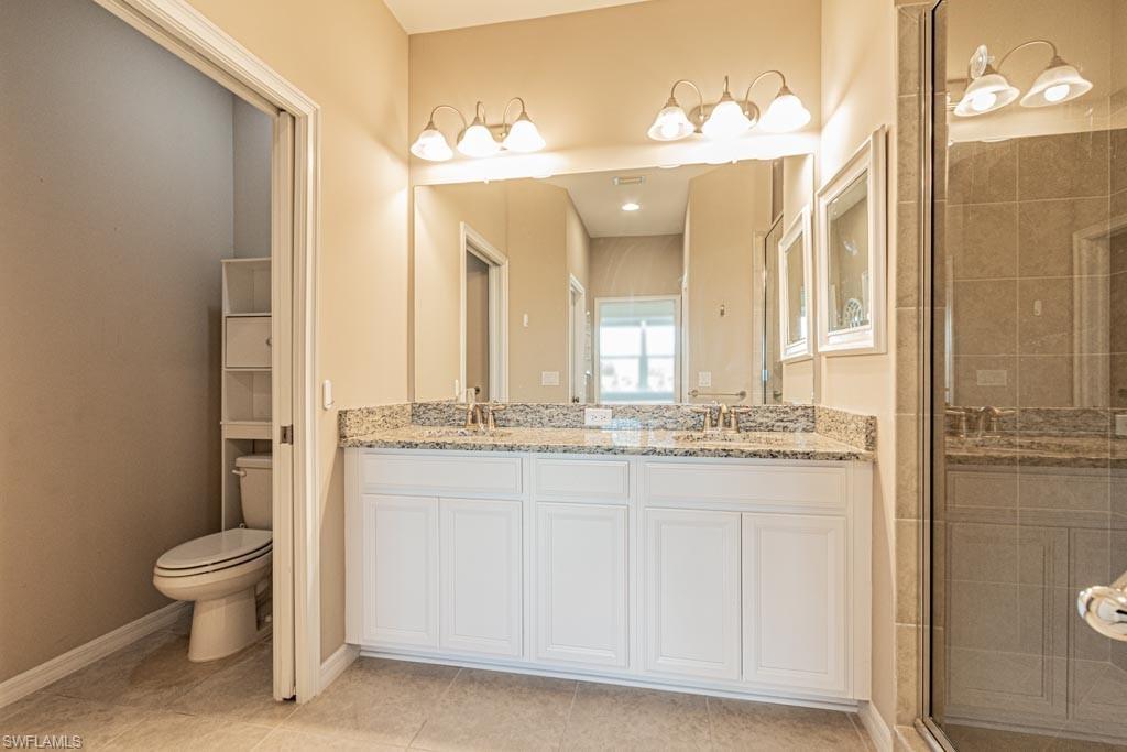 9378 Pocida Court, Unit 202 Naples, FL 34119 - Photo 10 of 41 double sinks, oversize master shower, seperate commode area, ceramic tile flooring,pocket doors