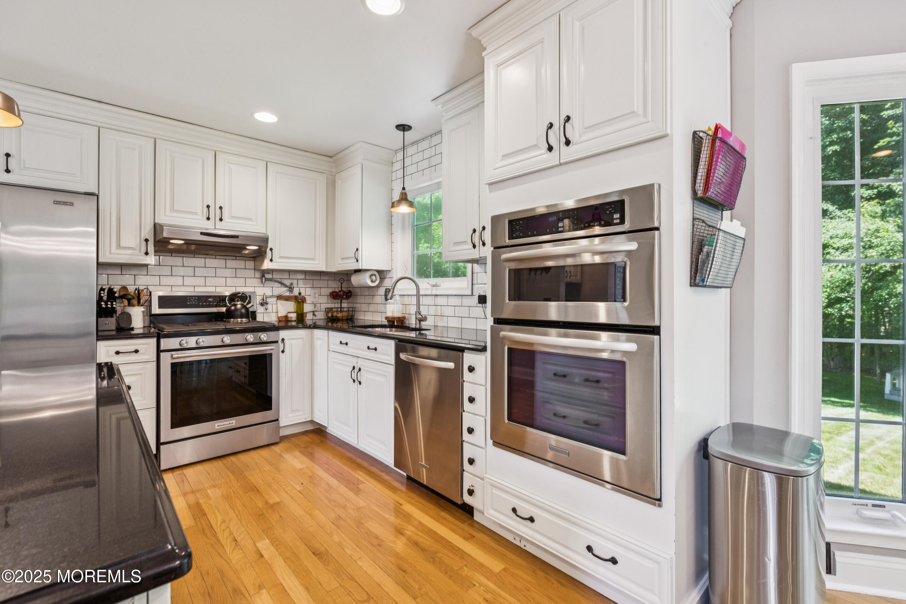 43 Sweet Gum Road Howell, NJ 07731 - Photo 16 of 48 a kitchen with granite countertop a stove top oven and refrigerator