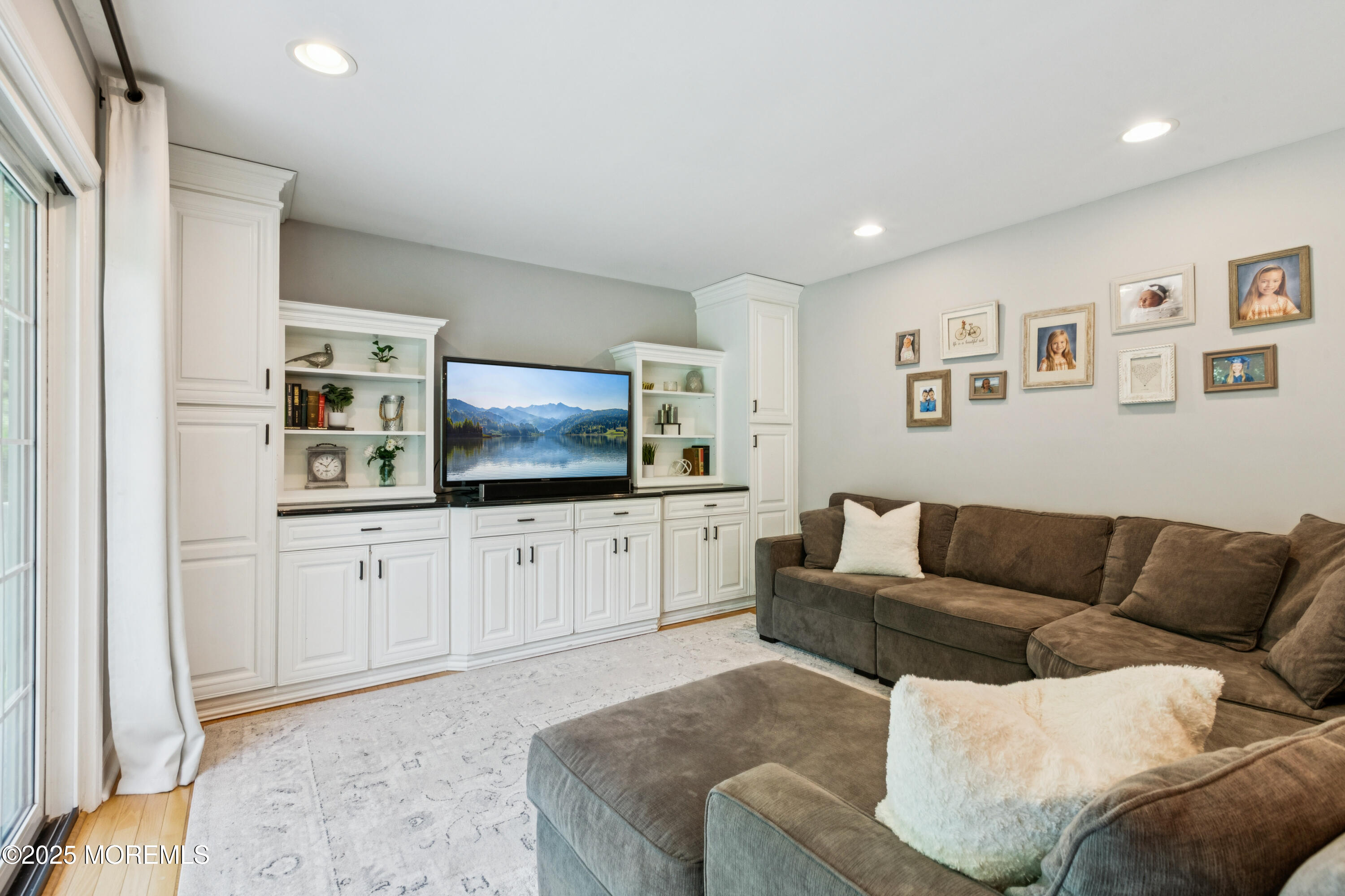 43 Sweet Gum Road Howell, NJ 07731 - Photo 20 of 48 a living room with furniture and a flat screen tv