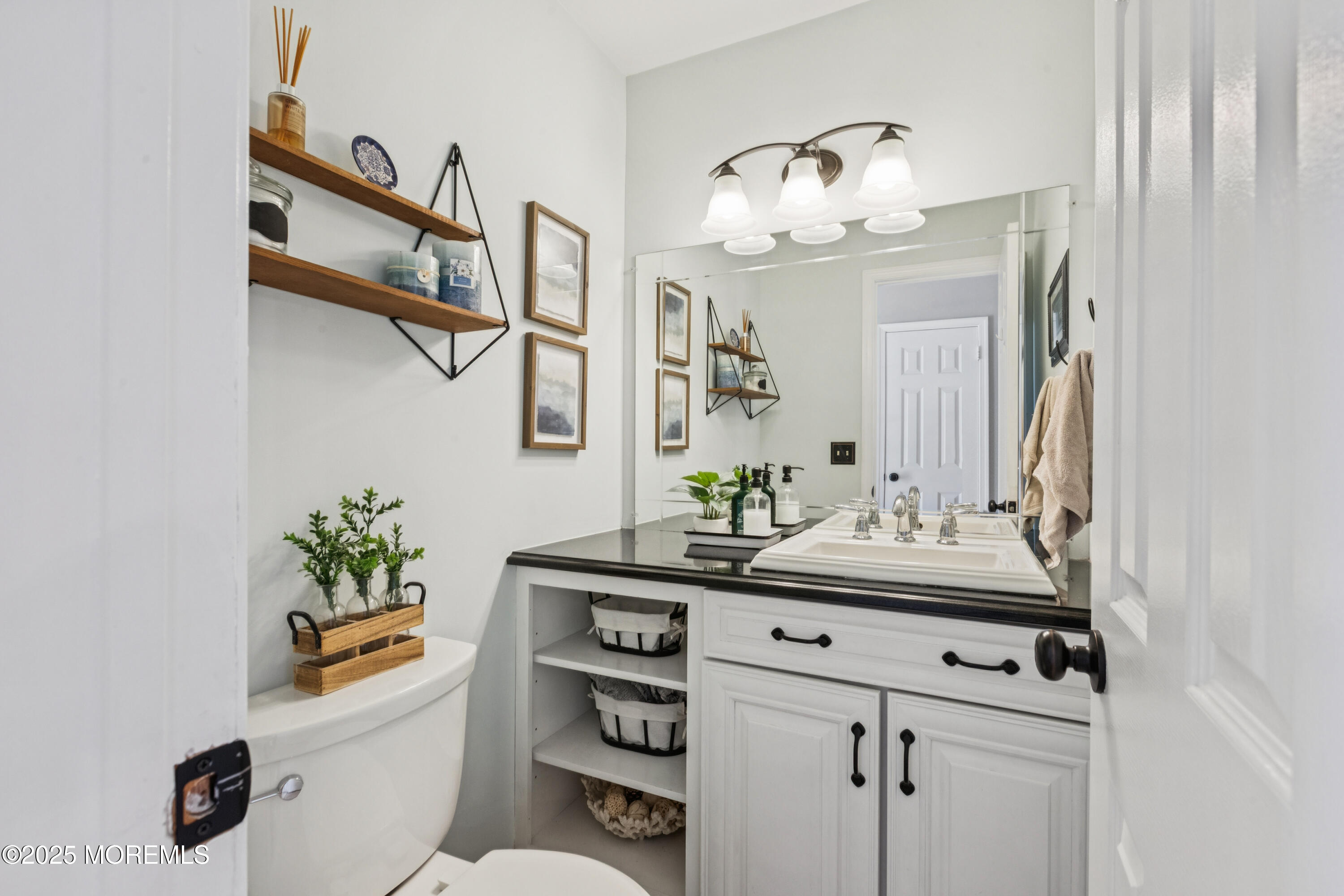 43 Sweet Gum Road Howell, NJ 07731 - Photo 21 of 48 a bathroom with a sink and a mirror