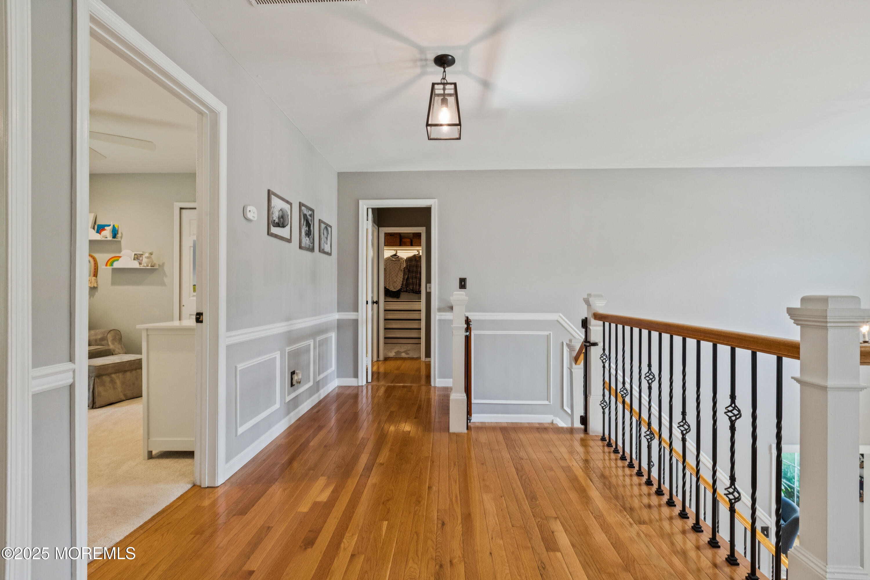 43 Sweet Gum Road Howell, NJ 07731 - Photo 24 of 48 a view of a hallway with wooden floor and a bathroom