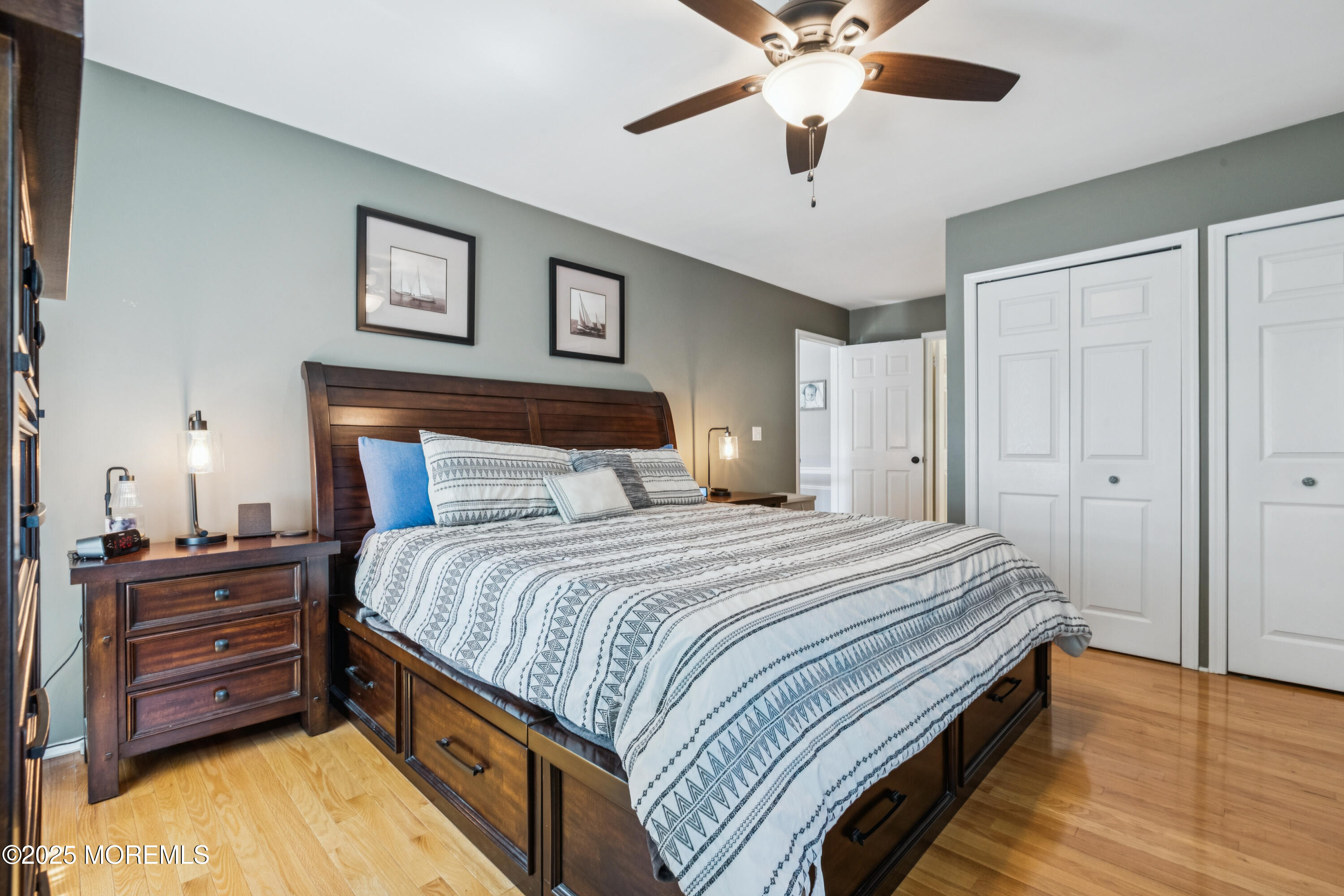 43 Sweet Gum Road Howell, NJ 07731 - Photo 25 of 48 a bedroom with a bed and a chandelier