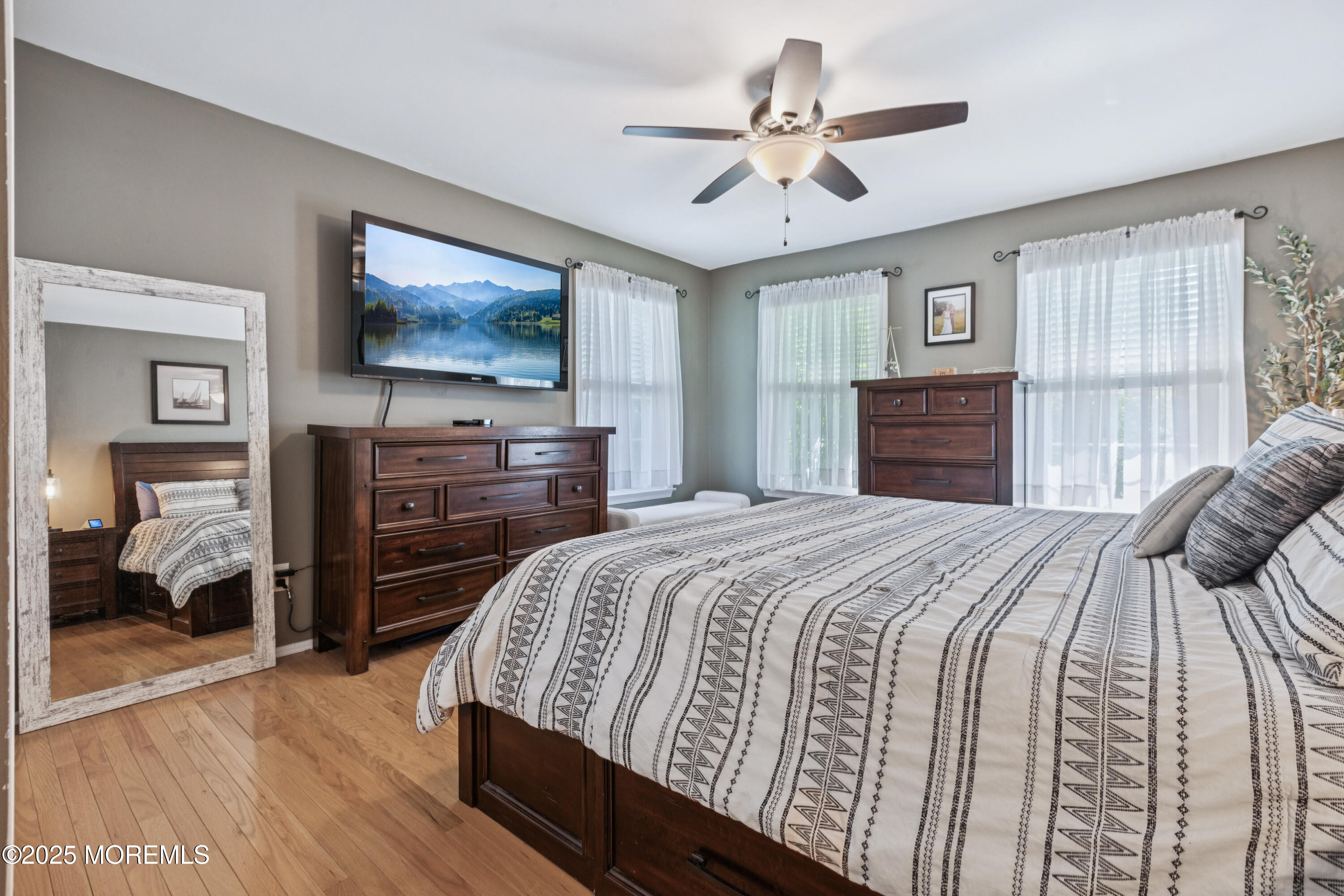 43 Sweet Gum Road Howell, NJ 07731 - Photo 26 of 48 a bedroom with a bed and a chandelier