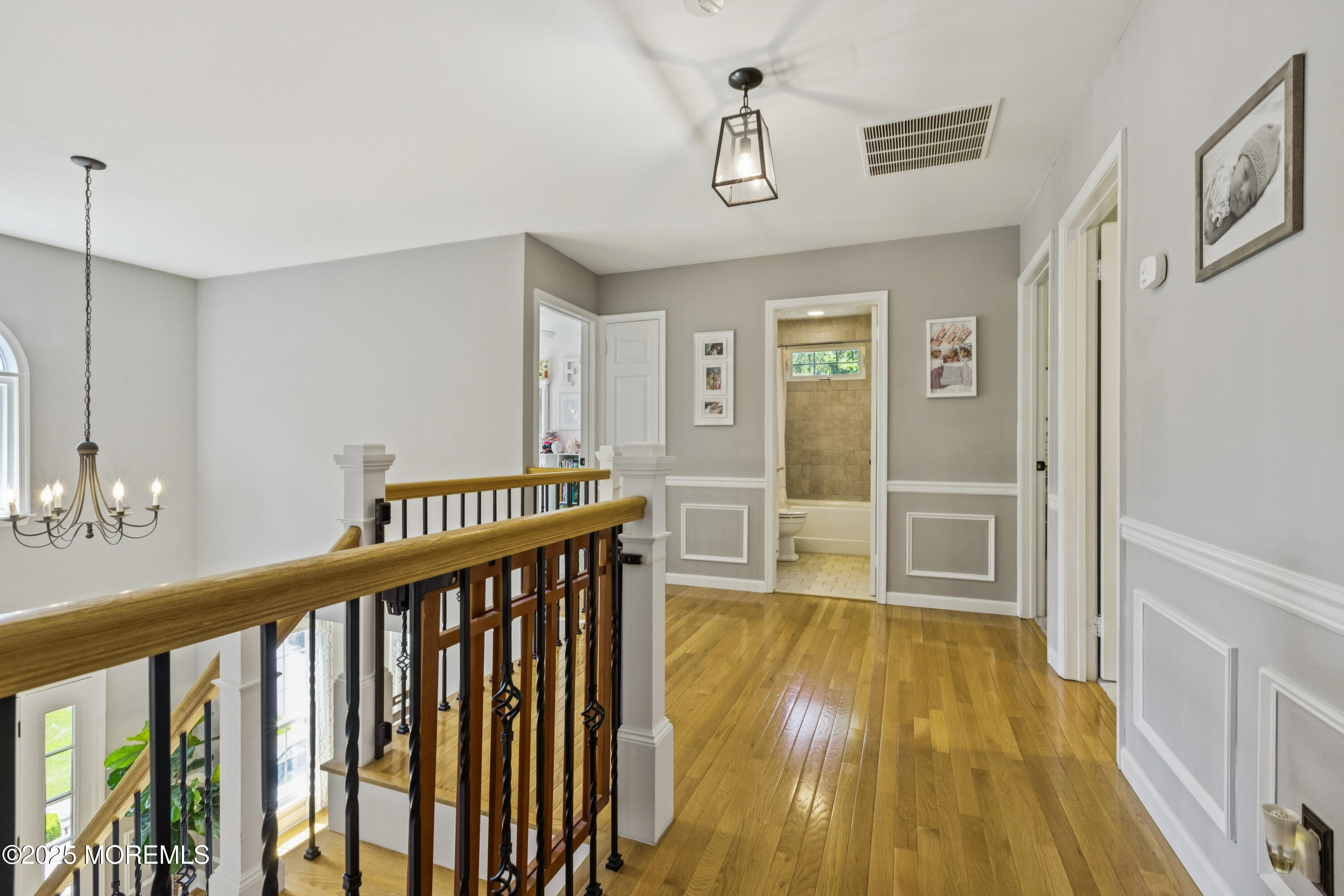 43 Sweet Gum Road Howell, NJ 07731 - Photo 31 of 48 a view of a hallway with wooden floor and staircase