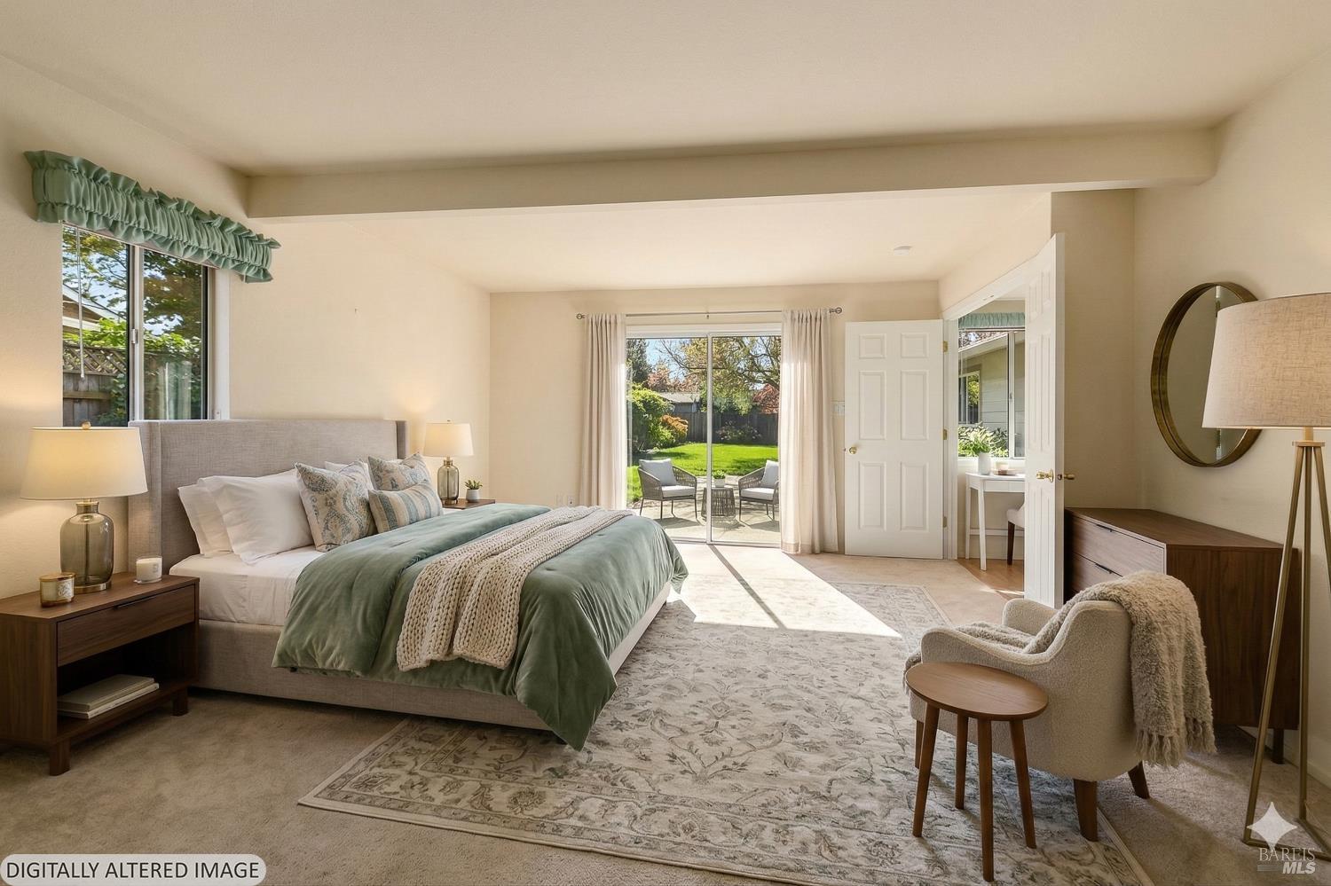 135 Fulton Place Windsor, CA 95492 - Photo 13 of 41 a spacious bedroom with a bed a table and chair