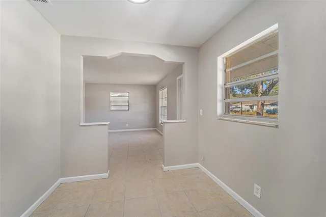 an empty room that has a window