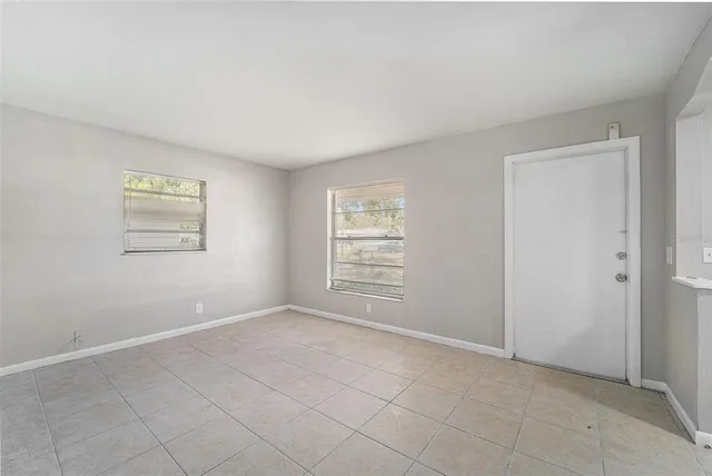 a view of an empty room with a window