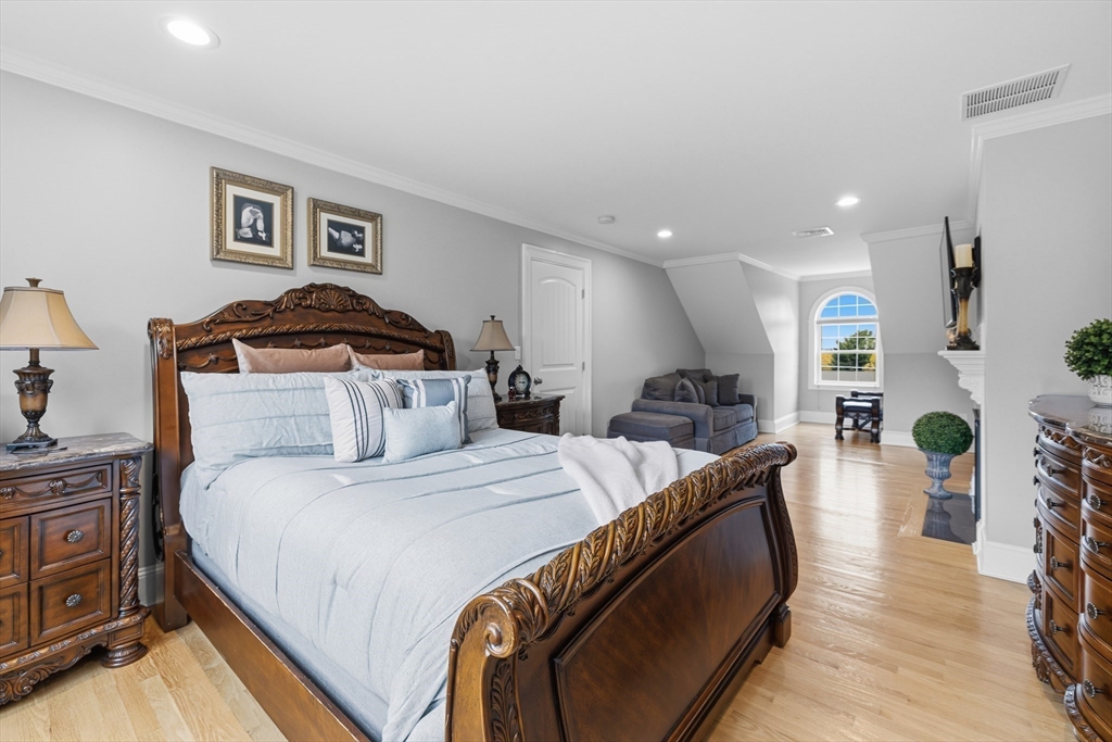 35 High Street Freetown, MA 02702 - Photo 34 of 40 a spacious bedroom with a bed and wooden floor