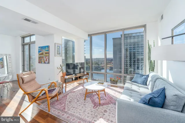 a living room with furniture and a large window