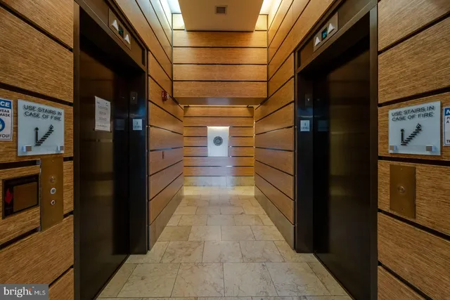 a living room with couches and a fireplace