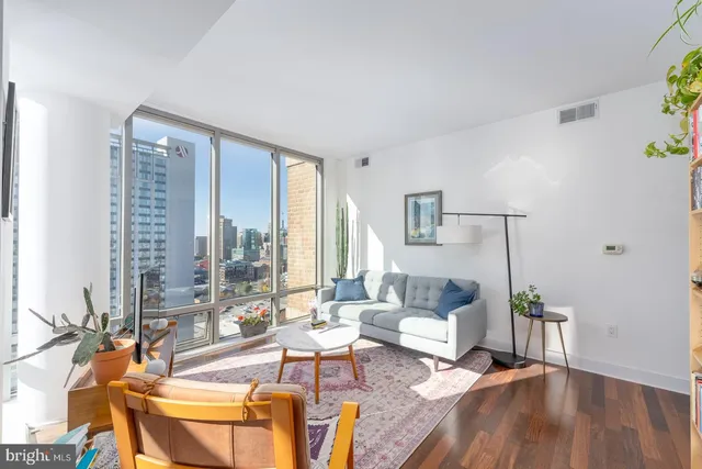 a kitchen with stainless steel appliances a stove a sink and a refrigerator