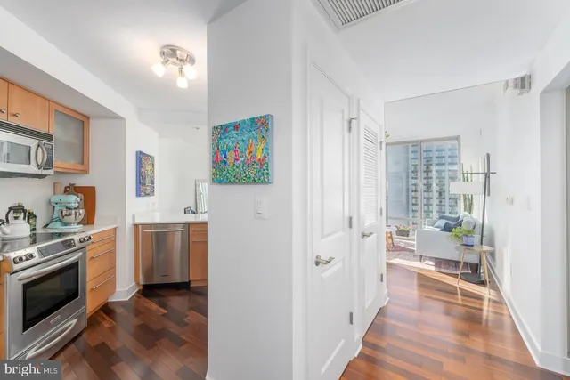 a kitchen with stainless steel appliances a refrigerator stove and sink
