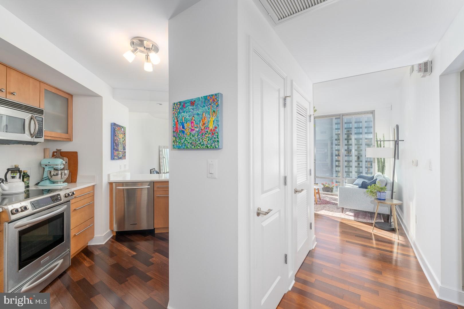675 President Street, Unit 2402 Baltimore, MD 21202 - Photo 4 of 27 a kitchen with stainless steel appliances a stove a sink and a refrigerator