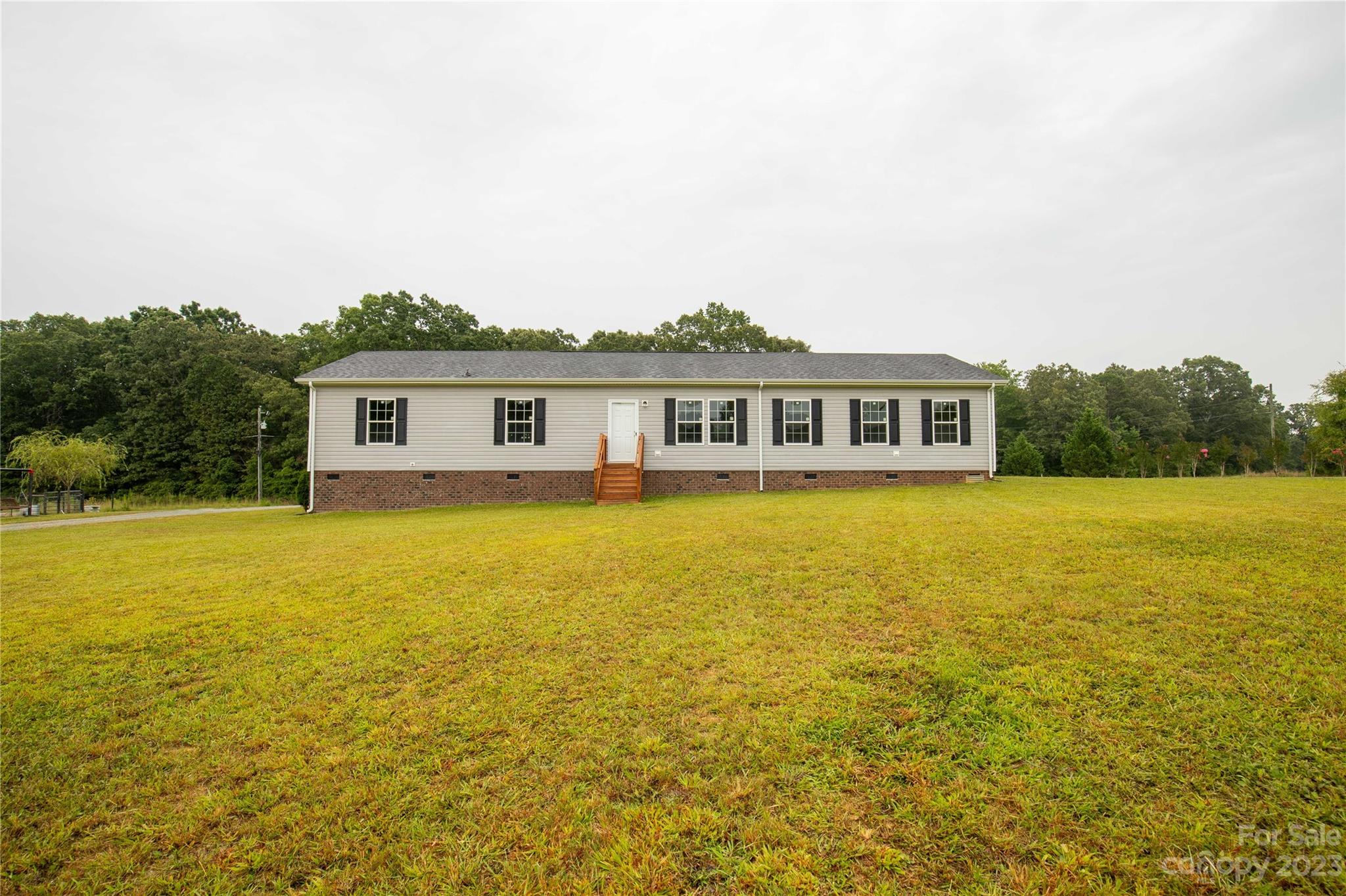 3052 Zeb Deese Road Lancaster, SC 29720 - Photo 1 of 34 a view of a house with a ocean view
