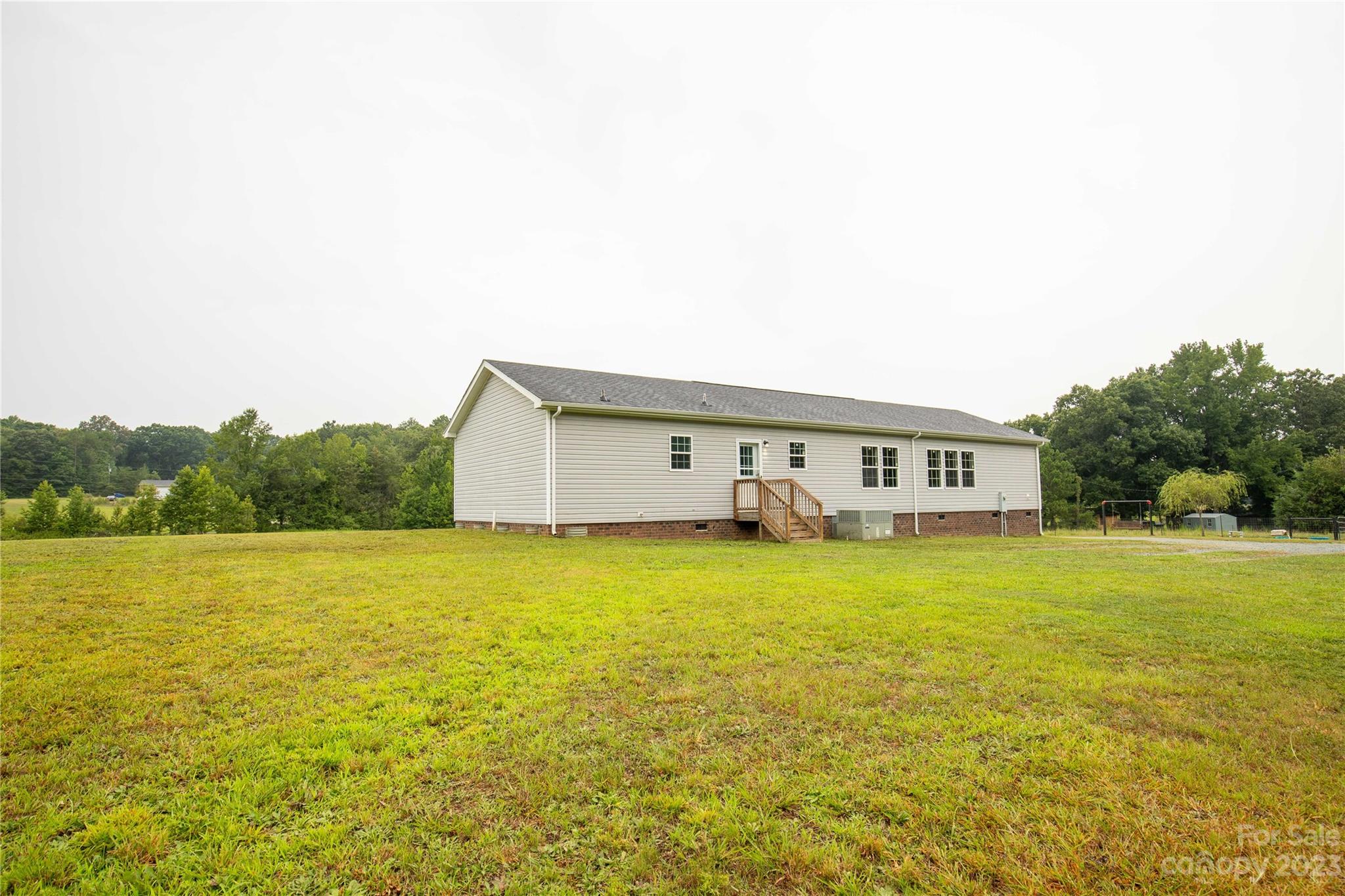 3052 Zeb Deese Road Lancaster, SC 29720 - Photo 27 of 34 a house view with swimming pool in front of it