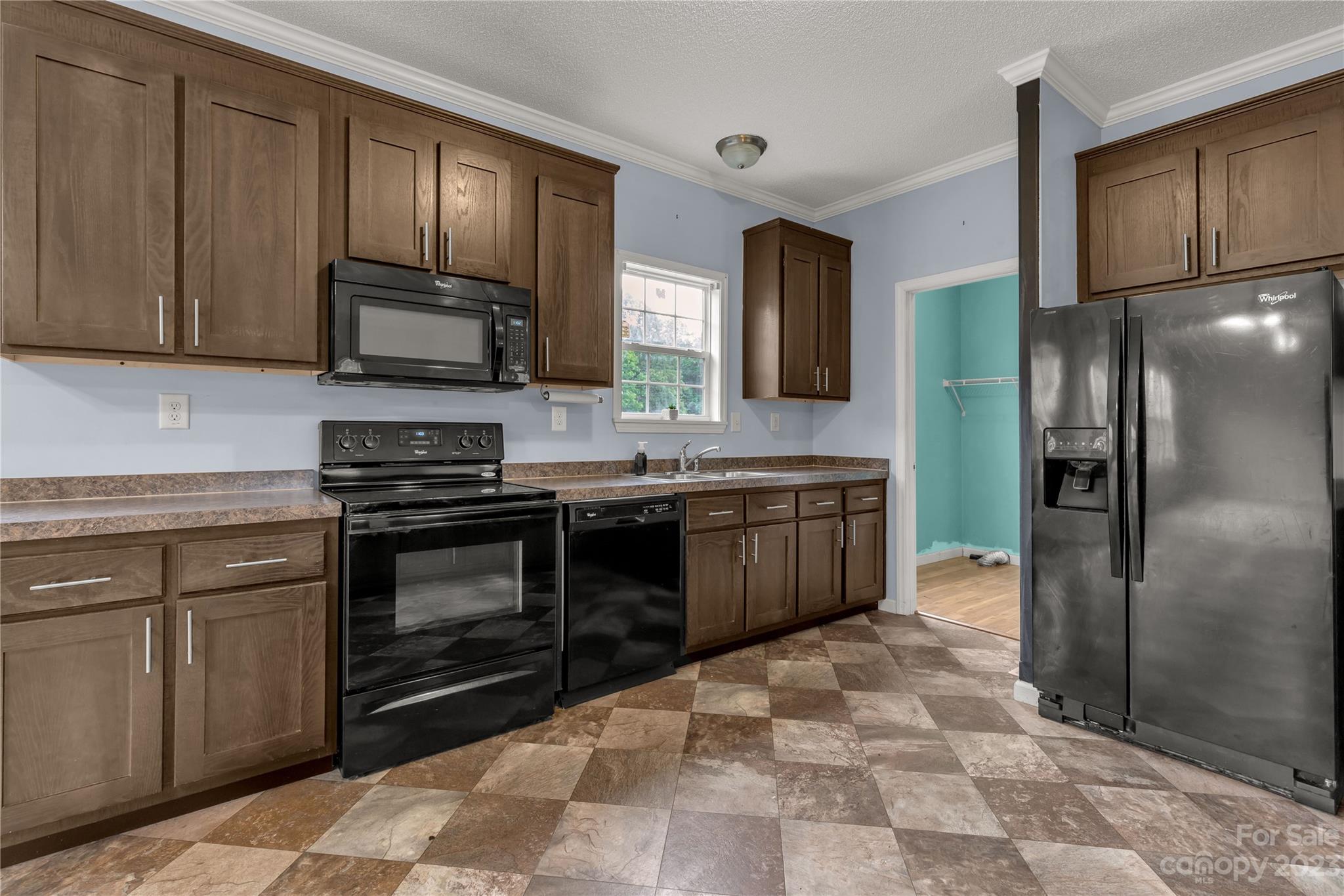 3052 Zeb Deese Road Lancaster, SC 29720 - Photo 9 of 34 a kitchen with stainless steel appliances and cabinets