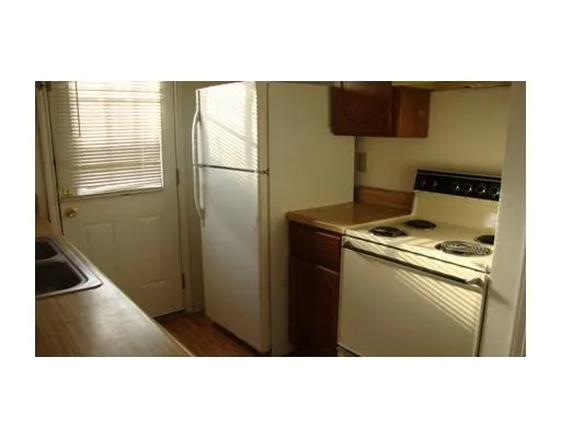 a picture of an empty room with a window