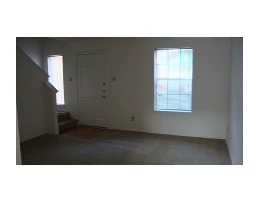 6702 Everhart Road, Unit G102 Corpus Christi, TX 78413 - Photo 3 of 4 a picture of an empty room with a window