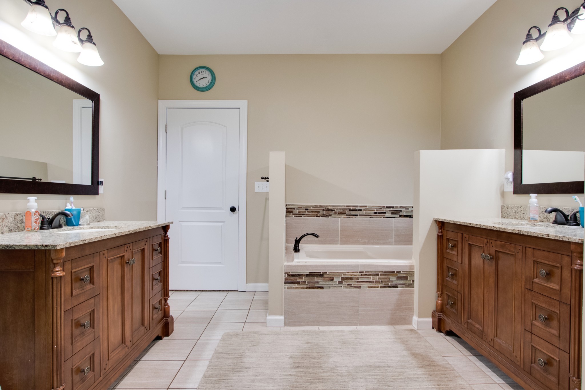 725 Fowler Ford Road Portland, TN 37148 - Photo 17 of 35 a spacious bathroom with a tub sink and mirror