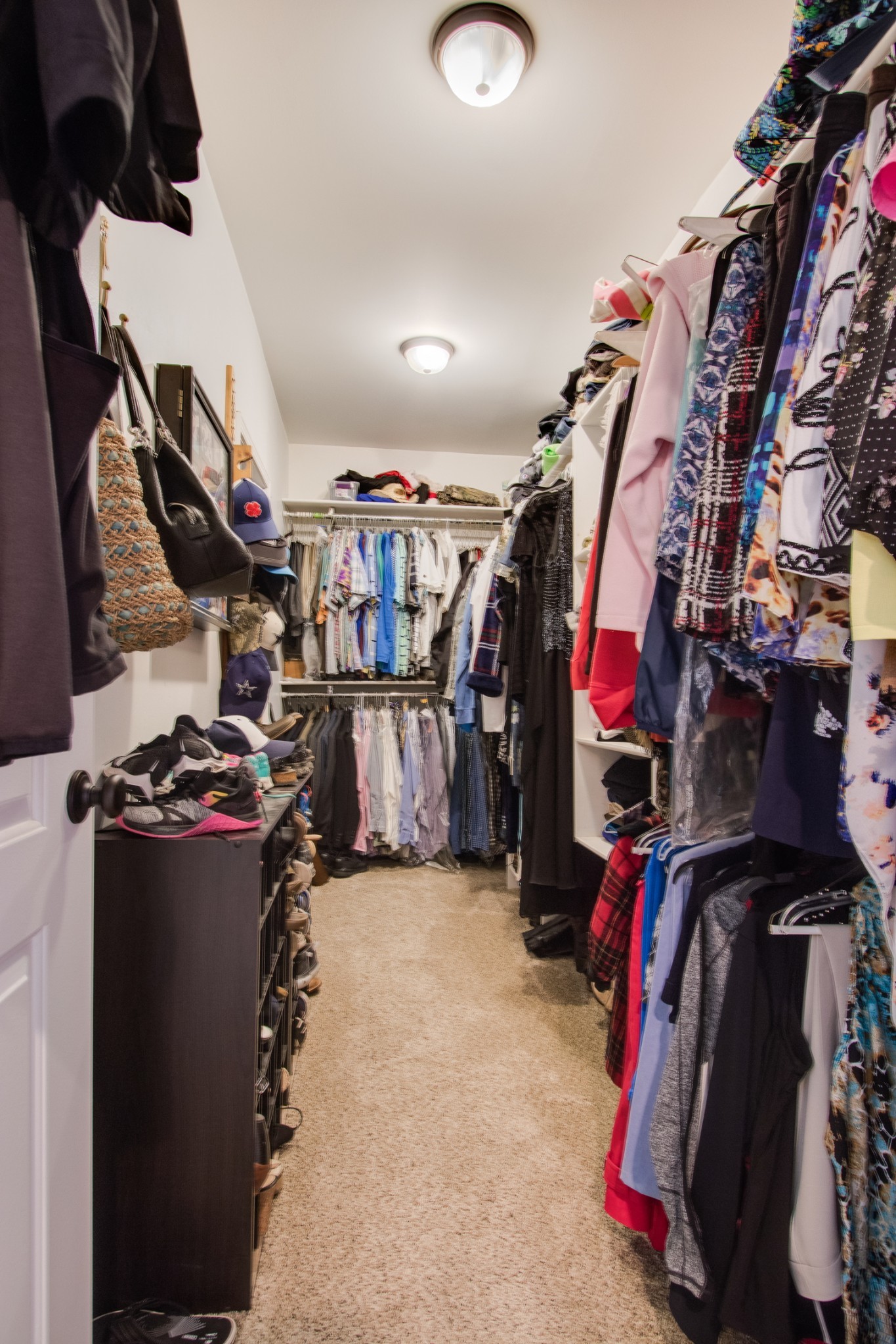 725 Fowler Ford Road Portland, TN 37148 - Photo 19 of 35 a view of walk in closet with clothes and shoes