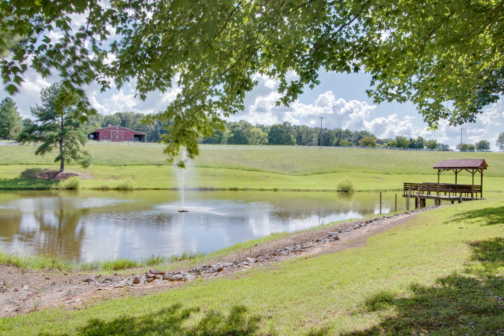 725 Fowler Ford Road Portland, TN 37148 - Photo 30 of 35 a view of a lake with a big yard