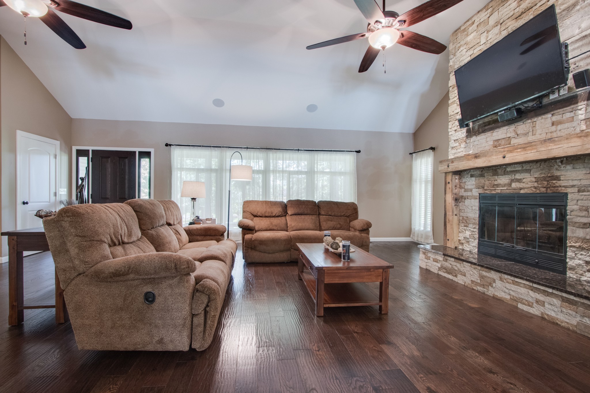725 Fowler Ford Road Portland, TN 37148 - Photo 7 of 35 a living room with furniture flat screen tv and a fireplace