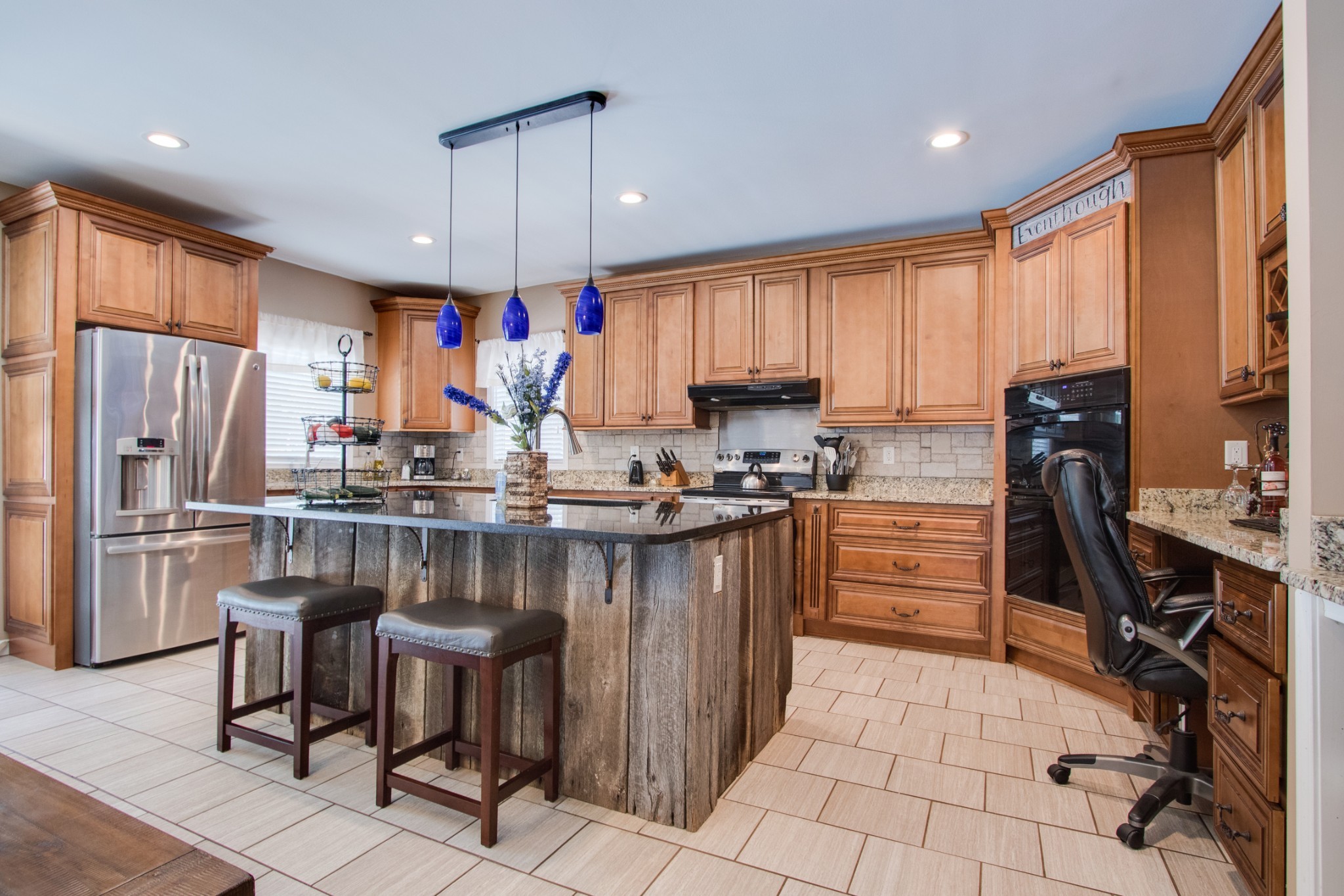 725 Fowler Ford Road Portland, TN 37148 - Photo 9 of 35 a kitchen with stainless steel appliances granite countertop a refrigerator stove top oven dining table and chairs