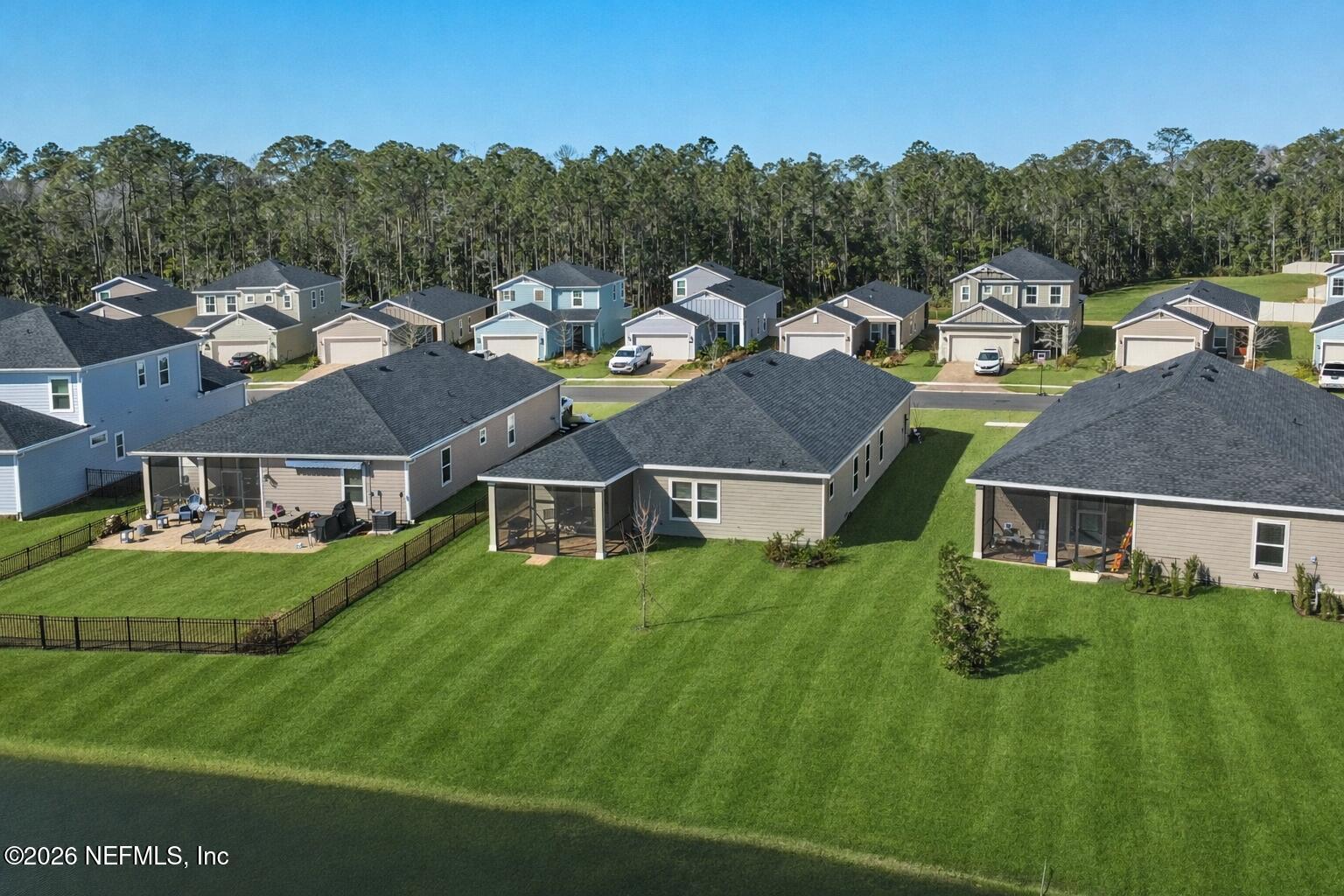 764 Lake Sinclair Street St. Augustine, FL 32084 - Photo 11 of 45 an aerial view of residential houses with outdoor space and trees