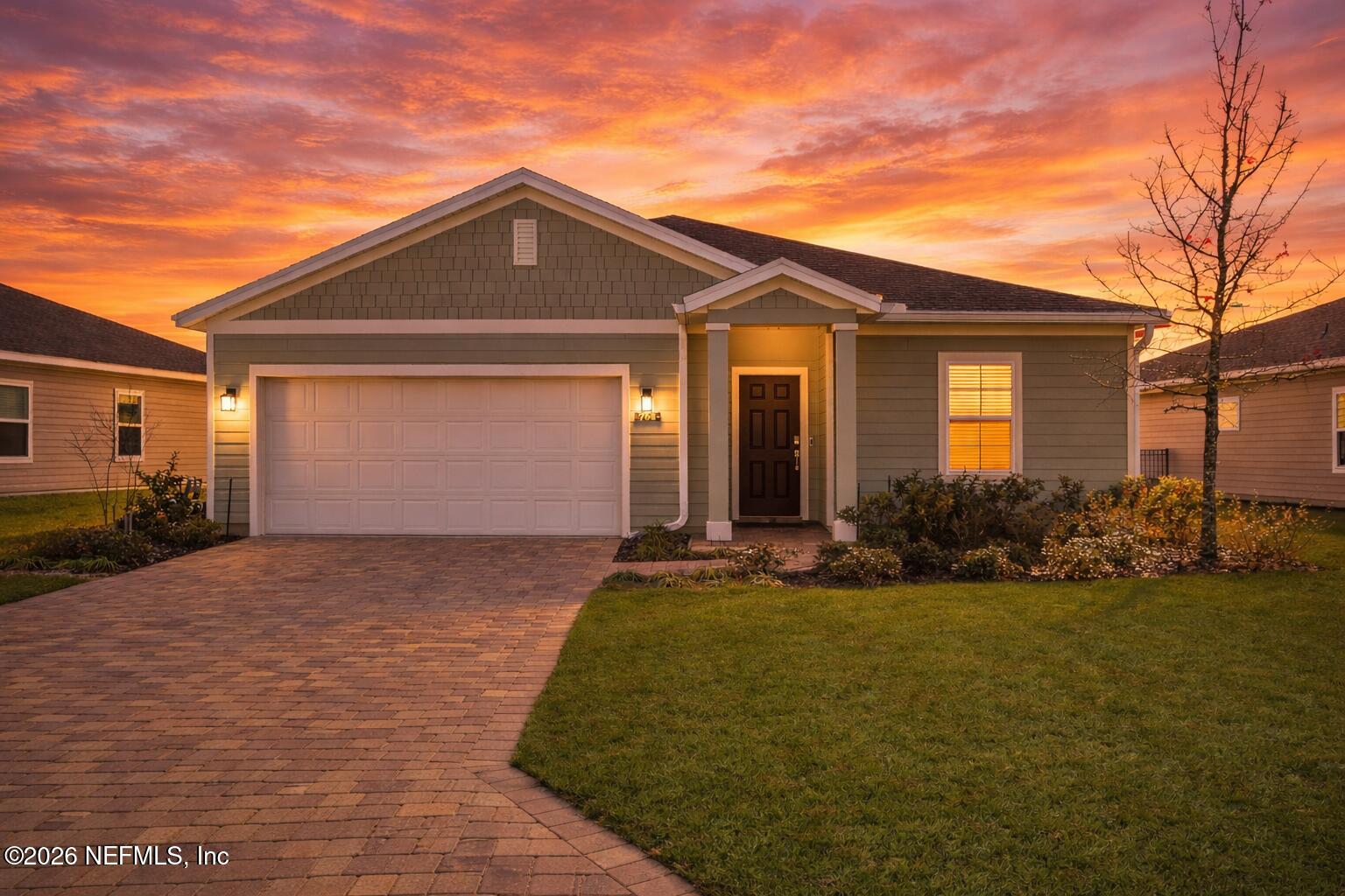 764 Lake Sinclair Street St. Augustine, FL 32084 - Photo 2 of 45 a front view of a house with a yard