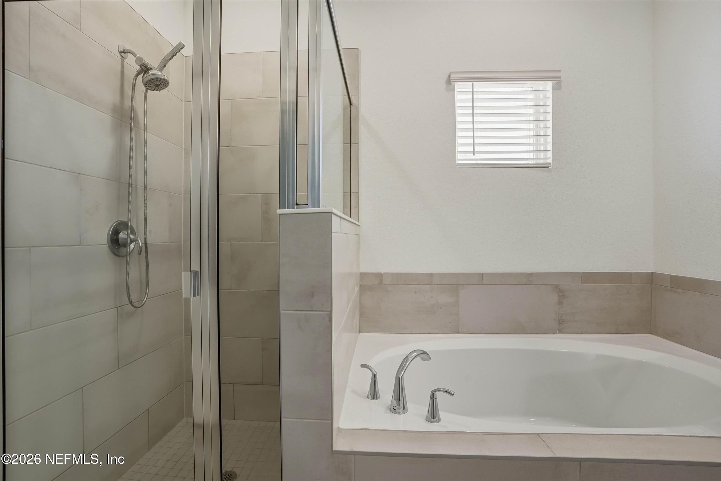 764 Lake Sinclair Street St. Augustine, FL 32084 - Photo 24 of 45 a bathroom with a bathtub and shower