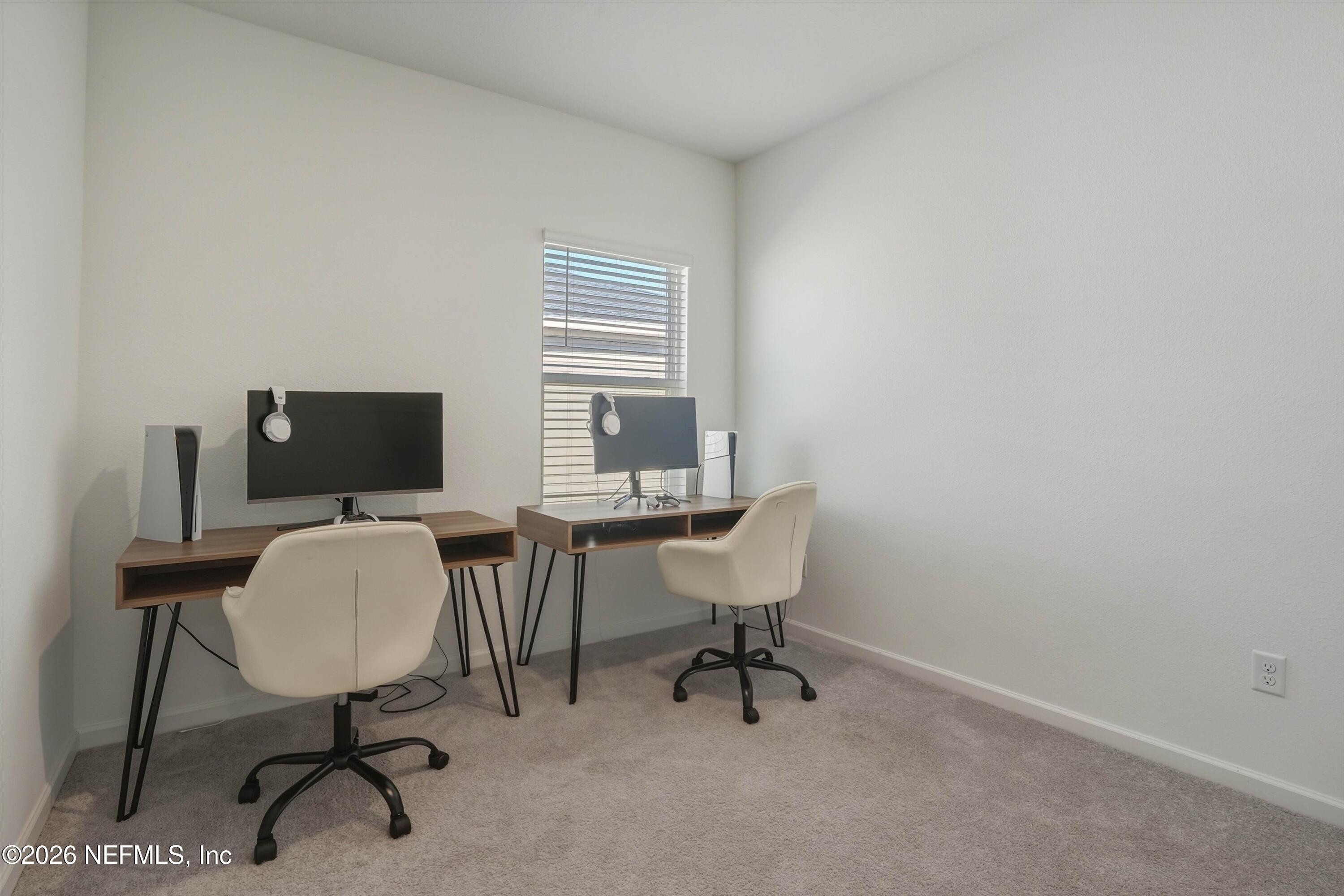 764 Lake Sinclair Street St. Augustine, FL 32084 - Photo 29 of 45 a view of a workspace with furniture and a window
