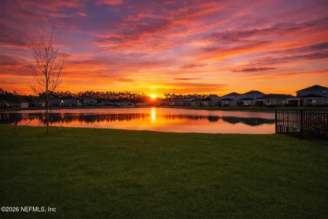 a view of swimming pool with seating area and barbeque oven