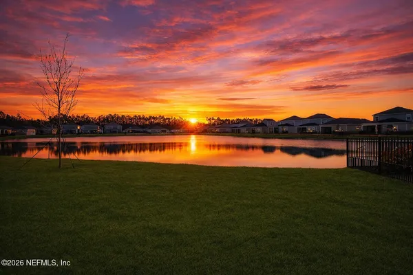 a view of swimming pool with seating area and barbeque oven