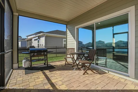 a view of sitting area with a bench in patio