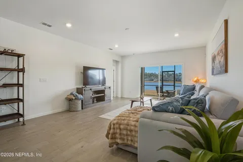 a bedroom with a bed and a television