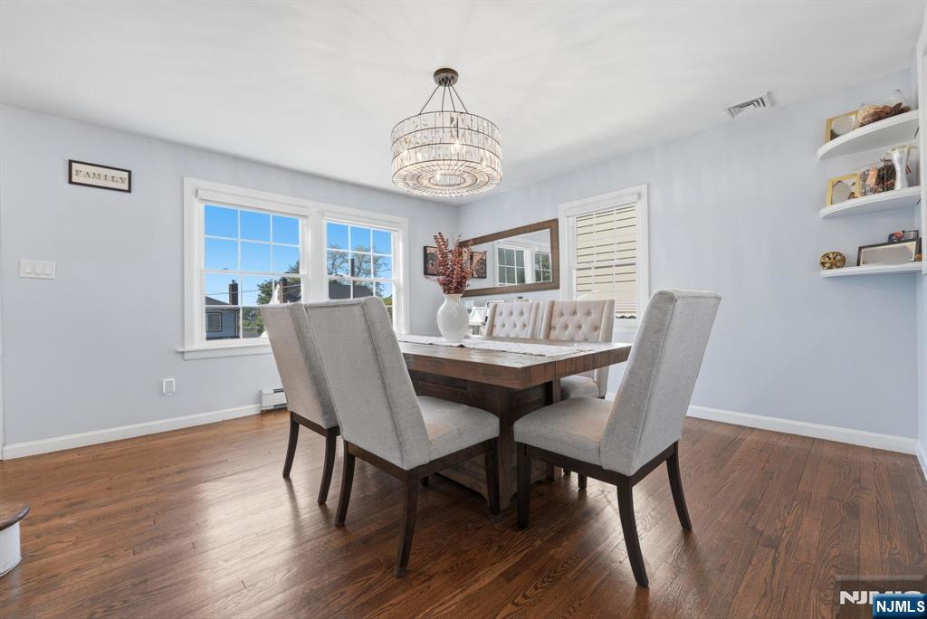 44 Alpine Place Kearny, NJ 07032 - Photo 19 of 50 a view of a dining room with furniture wooden floor and a chandelier