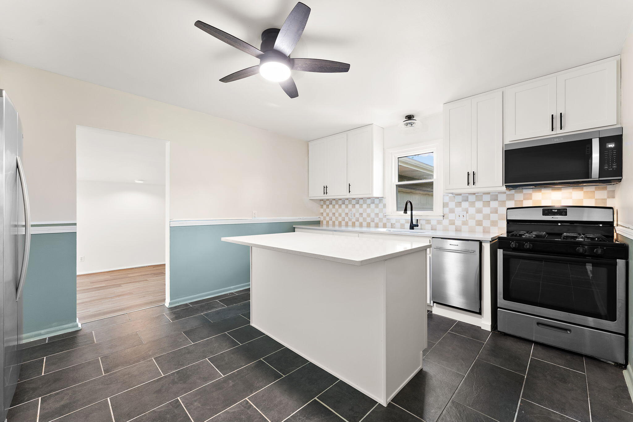 2201 Ade Avenue Valparaiso, IN 46383 - Photo 11 of 20 a kitchen with stainless steel appliances a stove a sink and a refrigerator