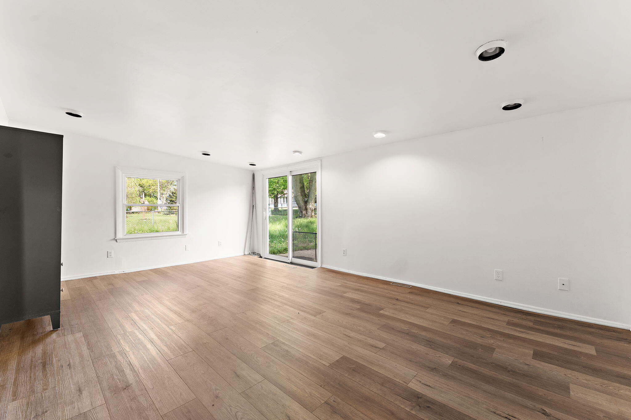 2201 Ade Avenue Valparaiso, IN 46383 - Photo 16 of 20 a view of an empty room with wooden floor and a window