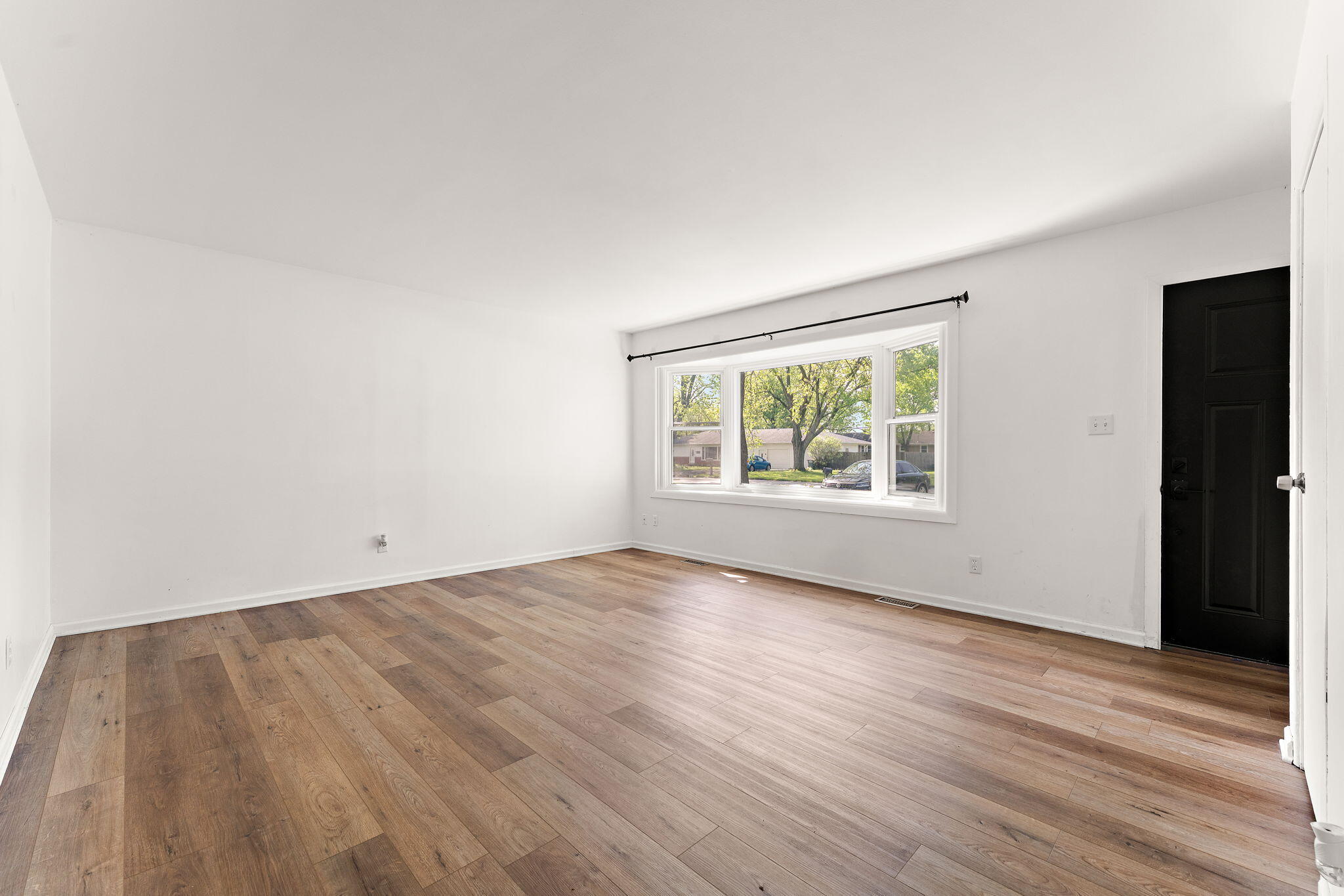 2201 Ade Avenue Valparaiso, IN 46383 - Photo 5 of 20 wooden floor in an empty room with a window