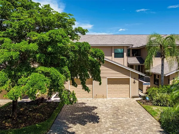 a view of a house with a tree