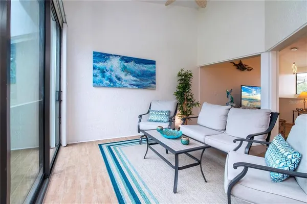 a living room with furniture and a rug