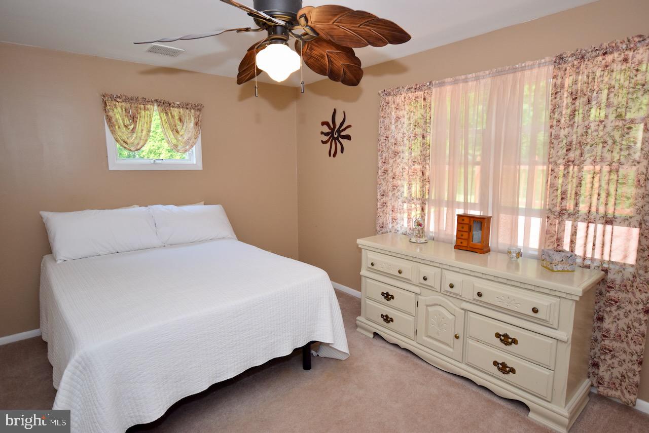 2419 Secane Road Secane, PA 19018 - Photo 22 of 46 a bedroom with a bed and a dresser