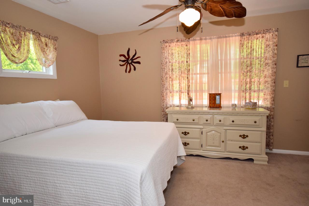 2419 Secane Road Secane, PA 19018 - Photo 24 of 46 a bedroom with a bed and a chandelier