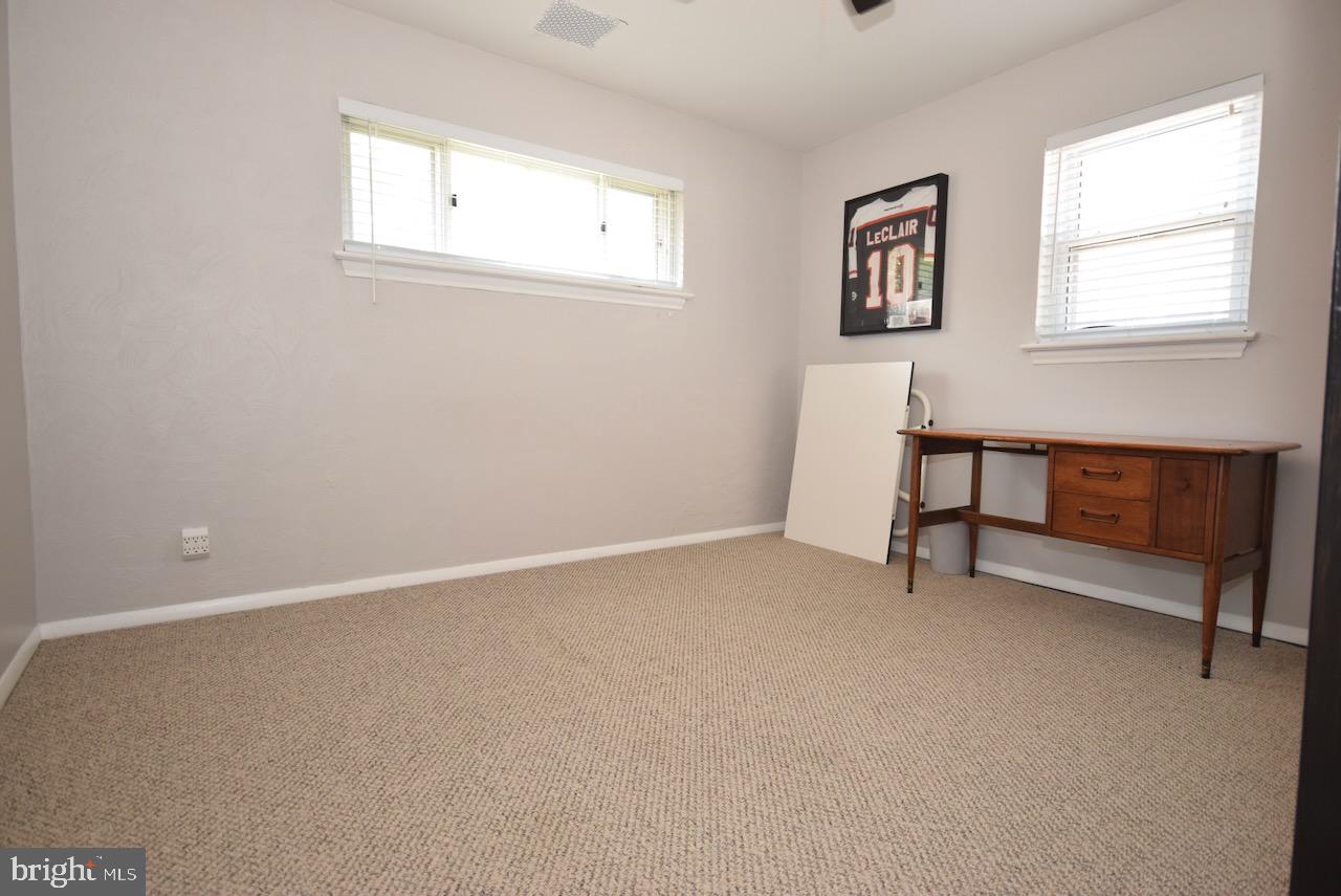 2419 Secane Road Secane, PA 19018 - Photo 31 of 46 an empty room with windows and chair