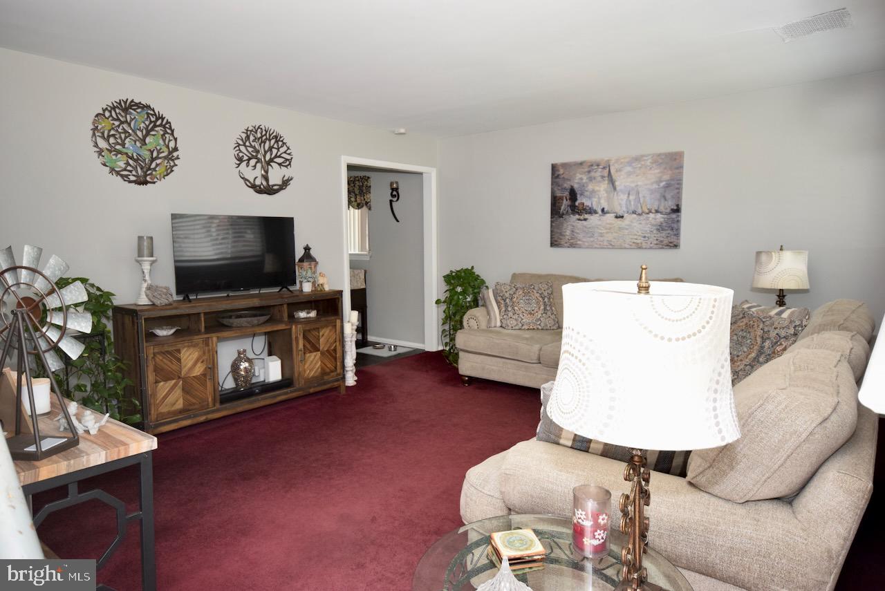 2419 Secane Road Secane, PA 19018 - Photo 10 of 46 a living room with furniture and a flat screen tv