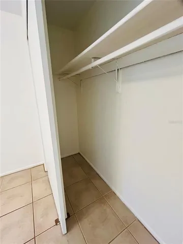 a view of an empty walk in closet