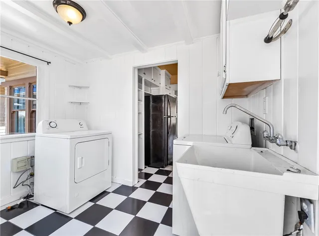 a kitchen with a sink and a refrigerator